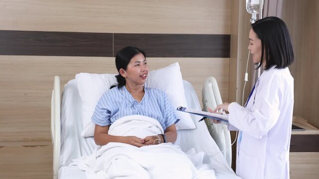Hospital, healthcare, medical, doctor, nurse consults smiling patient at bedside, offering trust, comfort, and emotional support in clinical setting with compassionate care, quality services clinic