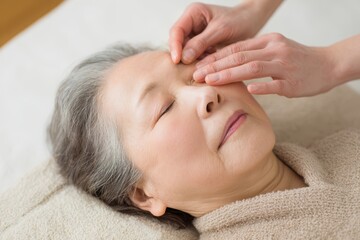 Elderly Woman Receiving Relaxing Eye Massage