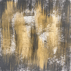 Obraz premium Abstract gold and black brushstroke texture painting with white accents on canvas.