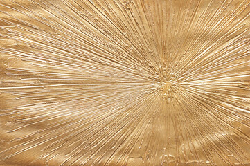 Obraz premium Golden textured abstract art with radiating lines and sunburst pattern on canvas.