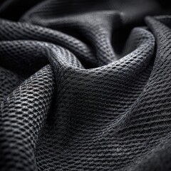 Extreme closeup macro of premium athletic fabric textile showing detailed texture breathability mesh weave and moisture wicking properties for technical performance sportswear apparel concept.