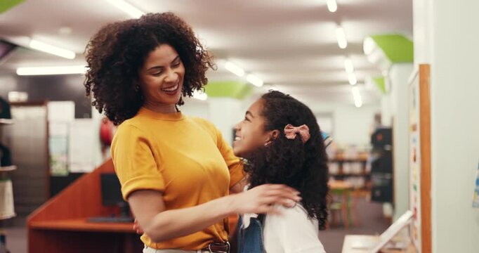 High five, child and teacher in library with smile, hug and preparation for test questions and education. Happy, tutor and support with girl for learning, literature and textbook for exam knowledge