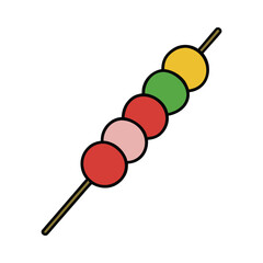 a colorful kabocha on a stick with red, yellow and green balls