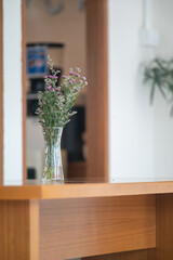 Vase with Wildflowers on Wooden Table