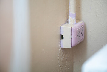 Close-Up of Damaged Electrical Outlet Wall