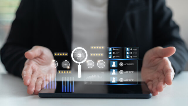 Businesswoman using tablet with AI magnifying glass, digital candidate profiles, data analytics, recruitment, and human resources technology concept. - Powered by Adobe