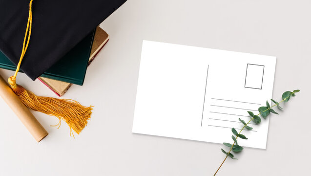 Post card with a picture of a graduation cap on top of it