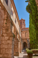 The majestic bell tower of the Monastery of Santa Maria de Piedra, Nuevalos, standing out above the cloister