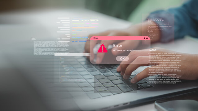 Hands typing on laptop with coding error alert popup, representing software bugs, programming issues, or system failure in development process and debugging in tech environments.