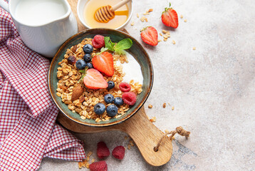 Healthy breakfast granola bowl with fresh berries