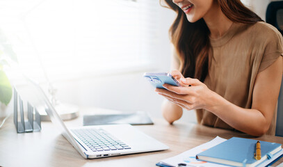 Working Process in Modern Office. Young Woman Account Manager Working at Table with New Business Project. Typing keyboard,Using Contemporary Laptop