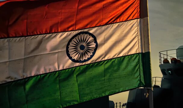 Celebrating Indian Navy Day Tiranga Flag Waving Proudly on a Naval Ship at Sunset, Showing Patriotism