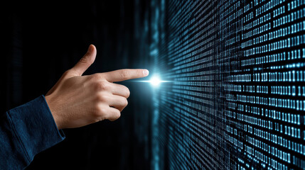 Hand touches glowing digital interface displaying binary code, symbolizing technology