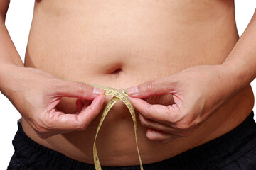 Overweight Women stressing over fat belly, using measuring tape. Fat woman with tape measure.