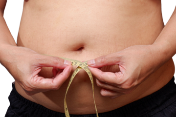 Overweight Women stressing over fat belly, using measuring tape. Fat woman with tape measure.