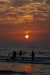 Sunset over the sea with cloudy sky 