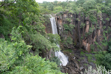 cenic 'sita khori waterfalls in maharashtra, india, cascading down rocky terrain and surrounded by lush green 'gautala autramghat sanctuary, a pristine natural destination for travel and eco tourism