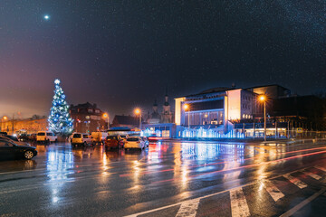 Fototapeta premium Parnu, Estonia. Endla Theatre, Christmas Tree And Endla Theater On Central Square In Evening Christmas Xmas New Year Illuminations