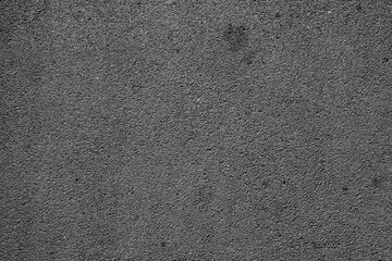 Dark asphalt rough texture. High resolution dark asphalt concrete surface texture, ideal for backgrounds and construction design.