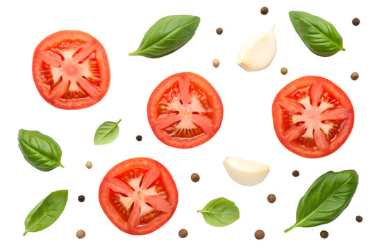 Sliced tomatoes basil leaves garlic cloves and peppercorns on black background tomato slices