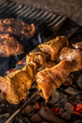 Juicy marinated meat skewers on charcoal grill