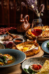 Georgian cuisine feast with khachapuri and wine
