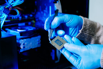 Closeup of technician holding CPU chip inside computer case, symbolizing hardware repair, upgrade, technology innovation, and IT service.