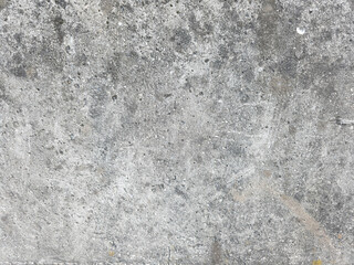 Obraz premium Rough gray concrete wall texture with natural weathering detail