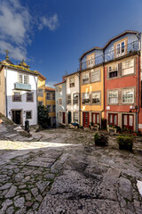 Colourful houses at a small square in the old town of Porto, Portugal.