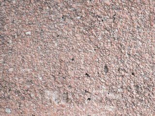 Rough pink pebble stone aggregate wall surface texture background