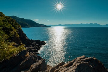 Bask in the glow of a Mediterranean sunrise over a rocky coastline, feeling the warmth and serenity of this idyllic travel destination