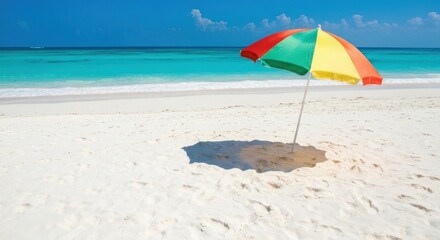 Colorful beach umbrella on a pristine white sand beach