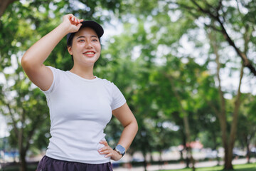 Young woman smiling enjoying outdoor fitness lifestyle