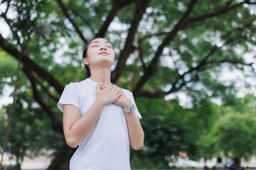 Young woman feeling peace and connection to nature