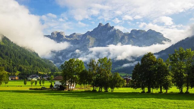 Time lapse of Fabulous view of Alpine green fields and mountains am Tennengebirge. Location: Werfenweng, im Pongau district, Salzburg state, Austria