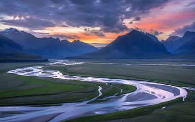 Fototapeta premium Serene twilight over winding river valley with majestic mountain silhouette