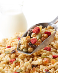 Fruit granola and milk on a white background