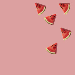 Creative composition made with watermelon slices on pastel pink backround.Summer fruit concept.Copy space
