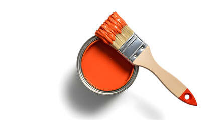 Close-up shot of an open paint can with orange paint and a paintbrush resting on top.