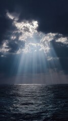 Dramatic Sun Rays Breaking Through Dark Clouds Over Ocean