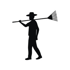 Silhouette Of A Man Carrying A Rake farmer
