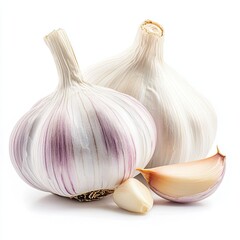 Obraz premium A head of garlic and a clove of garlic on a white background