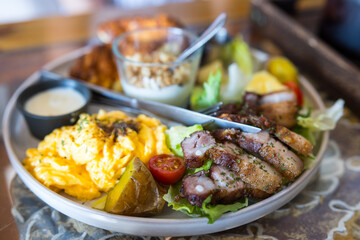 Full breakfast meal with meat and salad