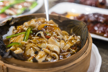 Traditional seafood razor clam cooked with herbs and sauce