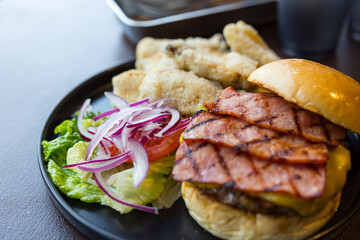 Burger with bacon and fried chicken