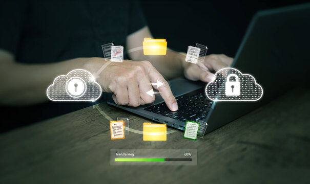 Secure cloud file transfer with hands using laptop, representing encrypted data synchronization, safe online storage, digital communication, and modern business technology. - Powered by Adobe