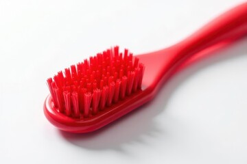 Close-up view of a vibrant red cleaning brush with dense bristles, ideal for detailed cleaning tasks