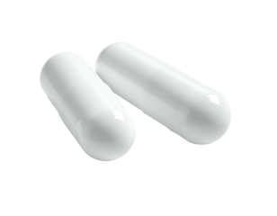 Two shiny white capsule pills on a black background, close-up