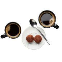 Elegant glossy black ceramic coffee cups with rich dark roasted coffee & crema, chocolate truffles, silver espresso spoon on white plate, top-down on transparent. Gourmet coffee concept