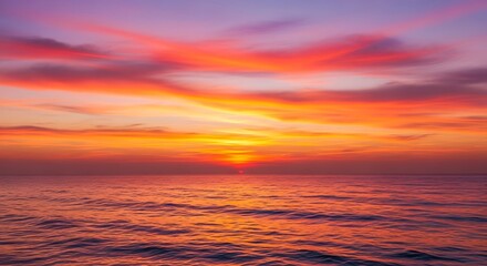 Fototapeta premium Vibrant Sunset Over the Ocean - A Colorful Seascape.
